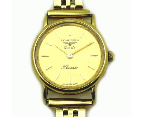 A vintage Longines Presence 9ct gold lady's wristwatch, circular gold dial with gold baton numerals, quartz movement, ref. 99
