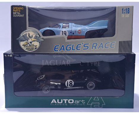 AutoArt and Universal Hobbies, a 1/18 scale mixed boxed pair to include Jaguar C-Type and Gulf Porsche. Conditions generally 