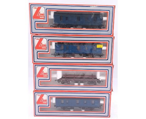 Lima, a boxed railway group comprising of 3x Parcel Vans along with a Twin Bogie Bolster Wagon With Steel Load. Conditions al