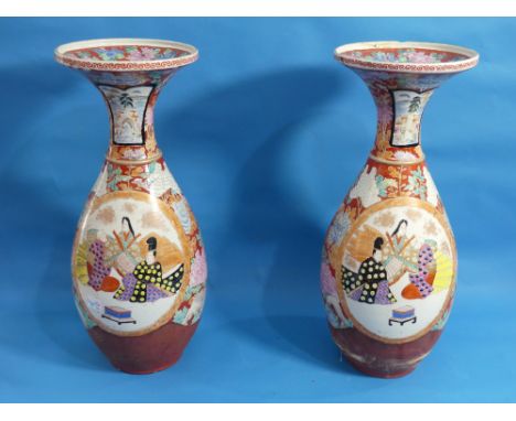 A pair of Japanese imari Vases, of ovoid form with flared necks, decorated with figures and Chrysanthemums, character marks t