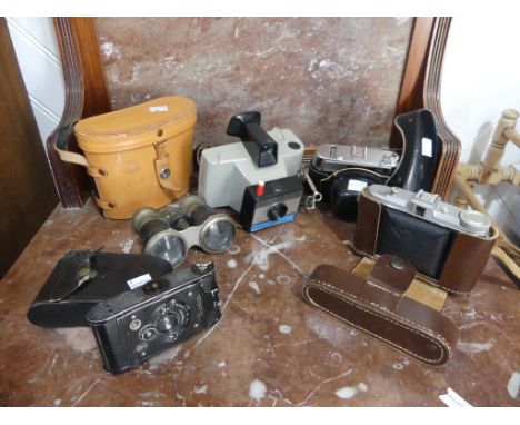 Four vintage Cameras, including a Polaroid Singer II Land Camera, an Agfa Isolette and a Picolette, all cased, together with 