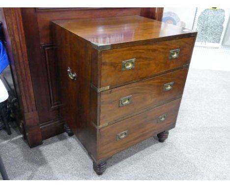 A 19th century Military Chest, with brass bound corners, the rectangular top above three long graduated drawers with recessed