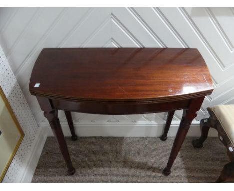 A 19th century mahogany fold-over Card Table, of rounded rectangular form, with concertina pull-out action, on ring-turned ta