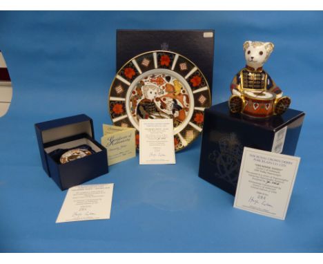 A Royal Crown Derby Limited Edition 'Drummer Teddy' Set, comprising a 'Drummer Teddy' 1999 Paperweight plate, commission excl