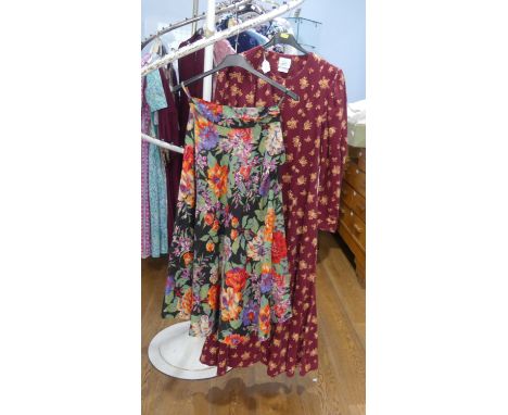 Vintage Fashion, Laura Ashley circa late 1970s/early 1980s: A red ground floral print cotton short sleeved summer dress, the 