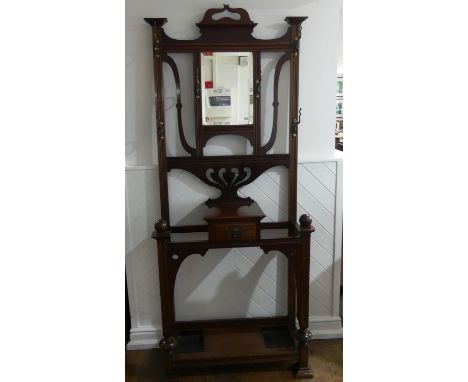 An Edwardian Art Nouveau style mahogany Hallstand, by James Shoolbred &amp; Co., of pierced and moulded upright form fitted w