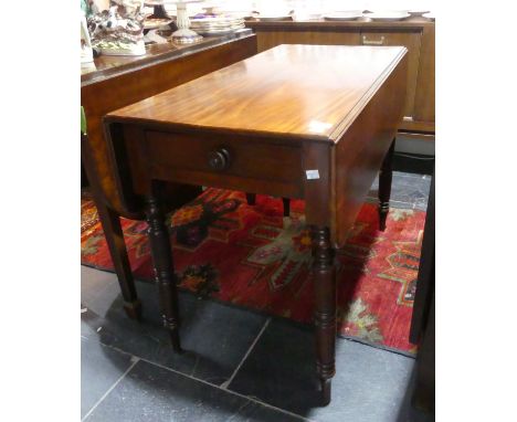 A 19th century mahogany Pembroke Table, the rectangular top above a frieze drawer and opposing dummy drawer, on ring-turned l