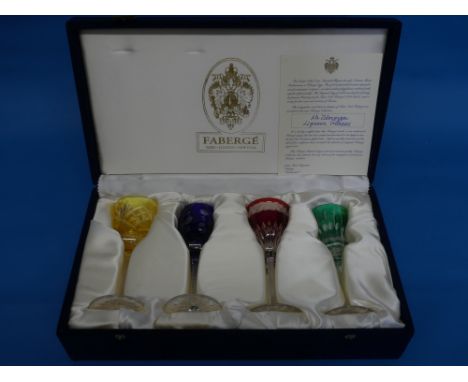 A cased set of four Fabergé crystal Liqueur Glasses, after the original designs by Peter Carl Fabergé, in blue, yellow, red a