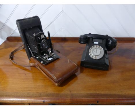 A vintage black Bakelite GPO 332L telephone, FWR 63/2, together with a vintage Contessa Nettel folding camera and leather cas