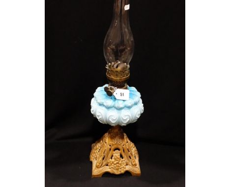     A Square Metallic Based Oil Lamp With Blue Glass Reservoir                      