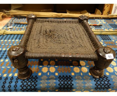     An Ethnic Rush Seated Low Stool On Four Turned Supports                         
