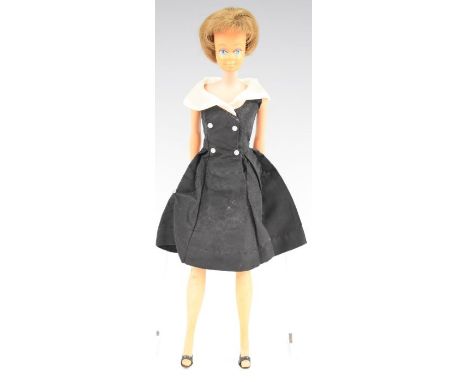 Barbie 'Midge' doll by Mattel with black/white cocktail dress, black shoes and jointed legs, c1965, stamped made in Japan to 