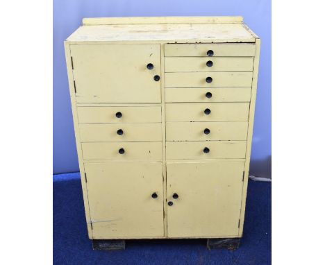 Vintage dentist's cabinet with an arrangement of ten drawers and three cupboards, some glass lined, W76 x D35 x H70cm