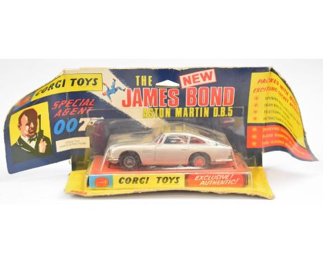 Corgi Toys diecast model James Bond 007 Aston Martin DB5 with silver body, red interior, opening roof/ejector seat, bandit pa