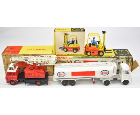 Three Dinky Toys diecast models comprising Jones Fleetmaster Cantilever Crane 970, AEC Fuel Tanker Esso 945 and Conveyancer F