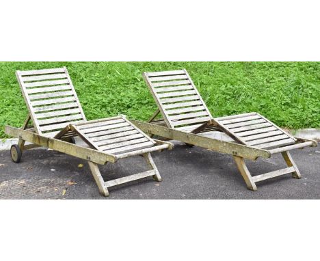 Pair of teak garden loungers with recline function, adjustable leg rest and side shelf and cushions, length 197cm