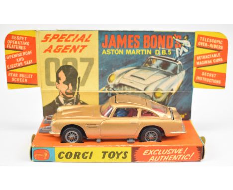 Corgi Toys James Bond Aston Martin DB5 with gold body, red interior, opening roof, ejector seat and bandit figure, 261, with 