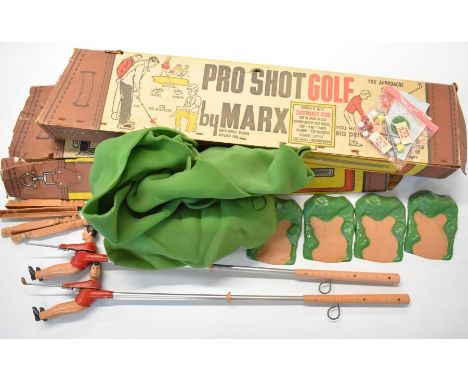 Two Pro Shot Golf toys by Marx to include two clubs with mechanical swing action, golfer, green, traps, balls, scorecards and