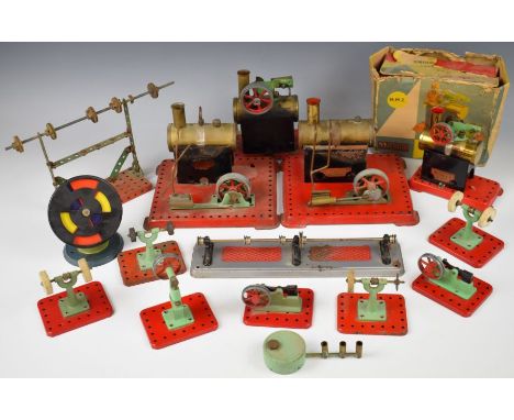 Four Mamod stationary live steam engines together with a collection of line shaft tools.