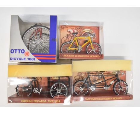 Four 1:10 scale diecast model bicycles and similar, all in original boxes.