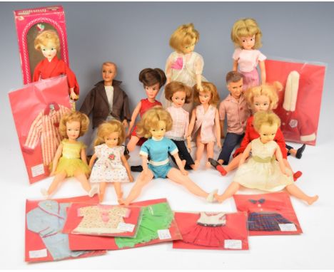 Thirteen Ideal Toy Company 'Tammy' dolls together with a range of vintage clothing and an original box.