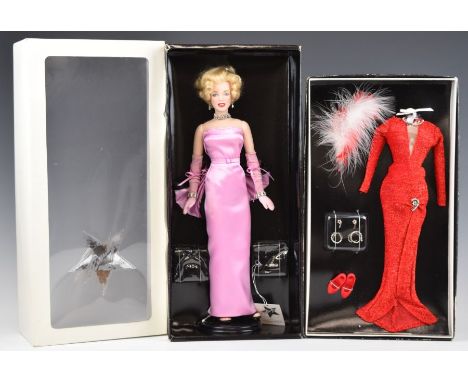 Franklin Mint Marilyn Monroe portrait doll in original box with stand, together with a Gentlemen Prefer Blondes red sequin dr