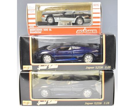 Three Maisto and Majorette diecast model sports cars comprising two 1:18 scale Jaguar XJ220 and a 1:24 scale Mercedes 500 SL 