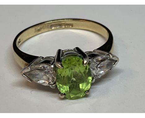 A 9 CARAT GOLD RING WITH A CENTRE SQUARE EMERALD WITH A CUBIC ZIRCONIA EACH SIDE SIZE L/M 