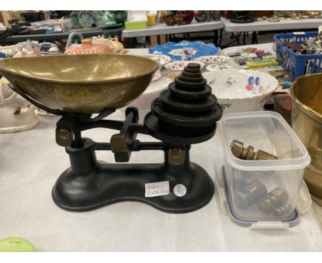 A VINTAGE SET OF WEIGHING SCALES WITH CAST AND BRASS WEIGHTS 