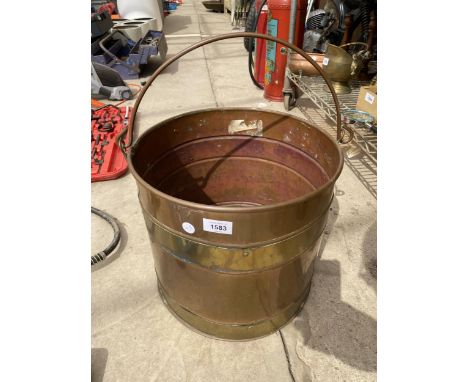 A VINTAGE COPPER AND BRASS COAL BUCKET 