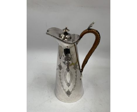 A VINTAGE SILVER PLATED WATER JUG 