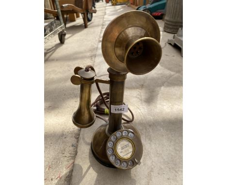 A VINTAGE BRASS STICK TELEPHONE BEARING THE STAMP G &amp;C 