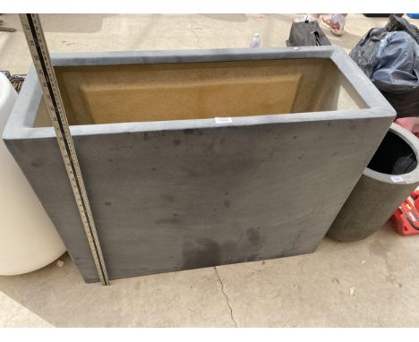 A GREY RECTANGULAR FIBRE GLASS TROUGH PLANTER (90CM x 70CM x 35CM) 