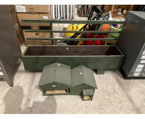 A WOODEN PLANT TROUGH WITH TRELIS BACK, A HEDGEHOG HOUSE AND A HANGING BIRD TABLE/ BIRD BOX 