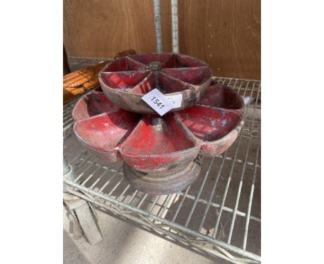 A VINTAGE REVOLVING CAST METAL STAND 