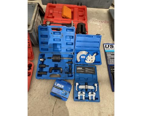 AN ASSORTMENT OF TOOLS TO INCLUDE A SPROKET PULLER KIT, A STRUT NUT KIT AND AN INJECTOR EXTRACTOR KIT ETC 