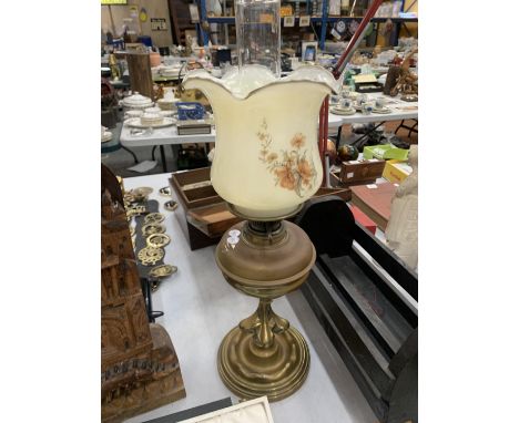 AN ARTS AND CRAFTS STYLE OIL LAMP WITH GLASS FLORAL SHADE 