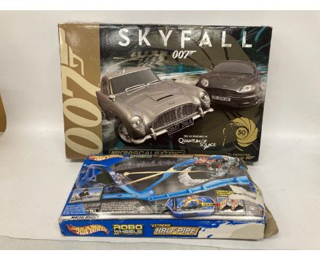 A BOXED MICRO SCALEXTRIC SET - JAMES BOND SKYFALL WITH BOTH CARS AND A BOXED HOTWHEELS ROBO WHEELS TRACK SET 