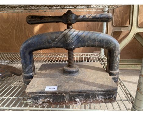 A VINTAGE CAST IRON BOOK PRESS 