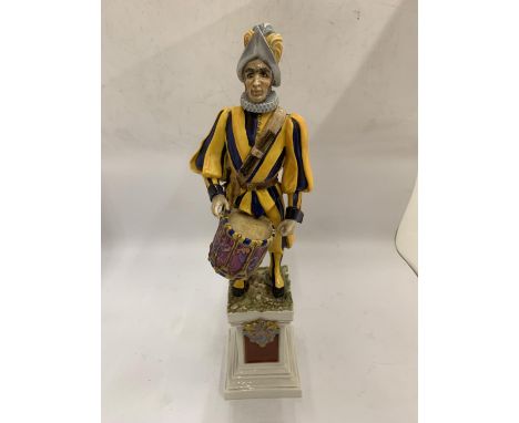 AN ITALIAN CERAMIC FIGURE OF A JESTER WITH SIGNATURE TO BASE HEIGHT 42CM 