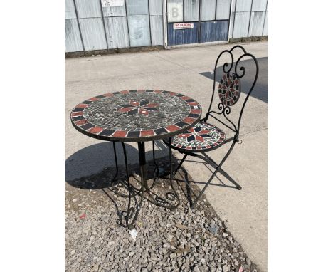 A METAL AND TILE TOPPED BISTRO TABLE AND SINGLE CHAIR 