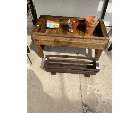 A WOODEN PLANTER, A SMALL WOODEN TROUGH AND VARIOUS PLASTIC PLANT POTS 
