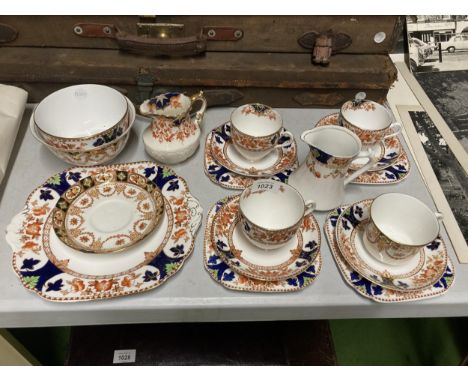 A CROWN DOUGLAS PART TEASET TO INCLUDE A CAKE PLATE, CREAM JUGS, SUGAR BOWLS, CUPS, SAUCERS AND SIDE PLATES 
