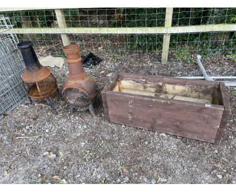 TWO METAL GARDEN CHIMENEAS AND A WOODEN TROUGH 