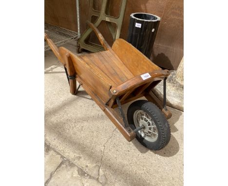 A MINIATURE VINTAGE OAK WHEEL BARROW 