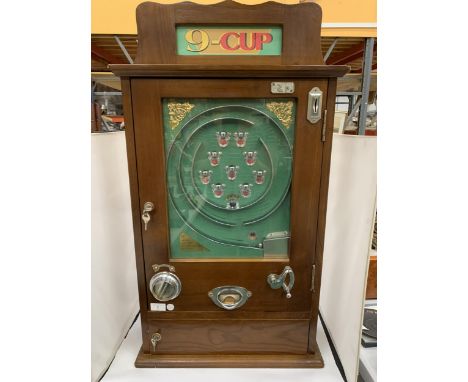 A VINTAGE 'NOSTALGIA MACHINES' NINE CUP ANFSTRIKE PENNY ARCADE GAME MACHINE 