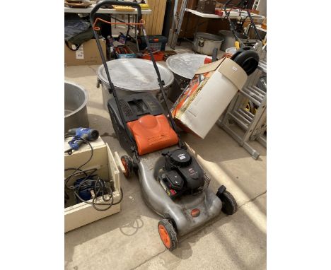 A FLYMO PETROL LAWN MOWER WITH A BRIGGS AND STRATTON ENGINE AND WITH GRASS BOX, BELIEVED IN WORKING ORDER BUT NO WARRANTY GIV