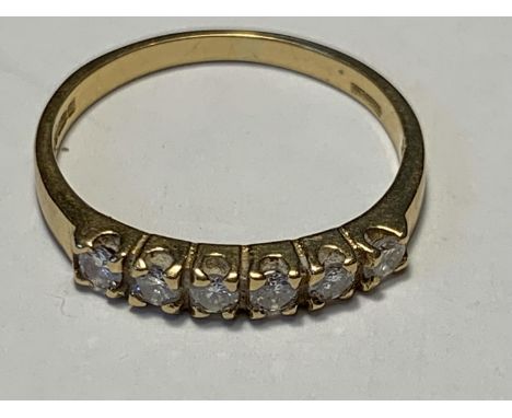 AN 18 CARAT GOLD RING WITH SIX IN LINE DIAMONDS SIZE L GROSS WEIGHT 2.16 GRAMS 