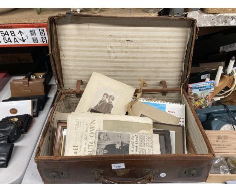 A VINTAGE LEATHER SUITCASE CONTAINING A QUANTITY OF EPHEMERA AND PHOTOGRAPHS 