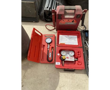 A BOXED MAC TOOLS DIFFERENTIAL CYLINDER PRESSURE TESTER, A BATTERY JUMP STARTER AND A CLARKE PRESSURE GUAGE 